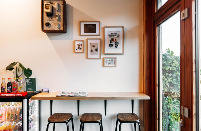A high table with bar seats.