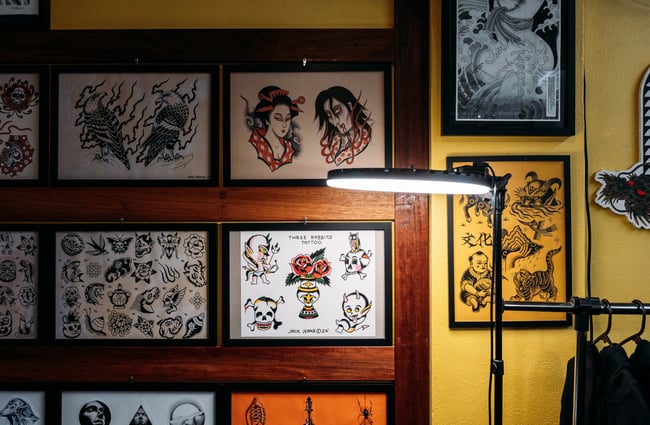 Tattoo designs on the wall at Three Rabbits Tattoo.