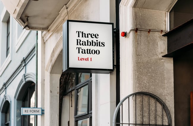 Three Rabbits Tattoo signage.