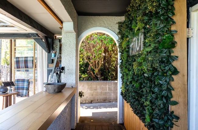 Archway entrance of Tini Bar in Akaroa