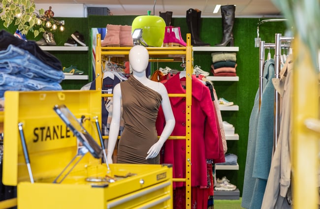 Mannequin and other clothing in the store at To Be Continued.