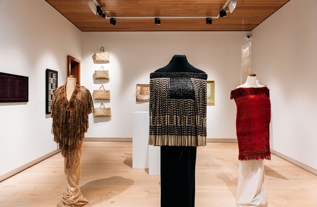 Maori cloaks on mannequins.