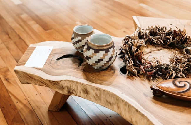 Two cups on a wooden table.