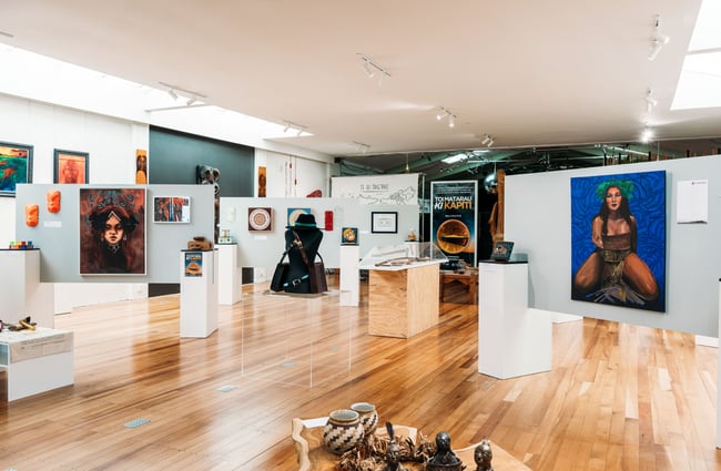 A large gallery space exhibition works of art.