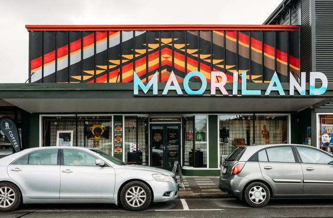 The exterior of a building that says 'MaoriLand'.