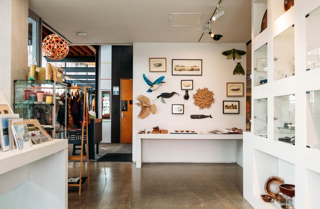Works of art on display on white walls.