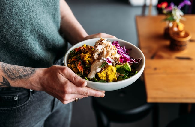 Big bowl of salad being served at Tom Thumb.