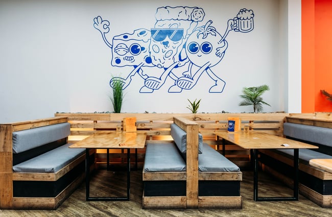 A blue illustration on a wall inside Tony's Pizza in Palmerston North.