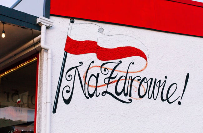 Artwork of a flag on the wall outside Topor.