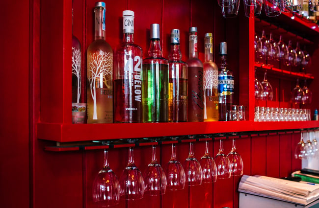 Close up of view of glasses and bottles.