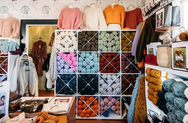 Colourful balls of yarn on display.