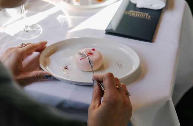 Woman about to eat dessert.