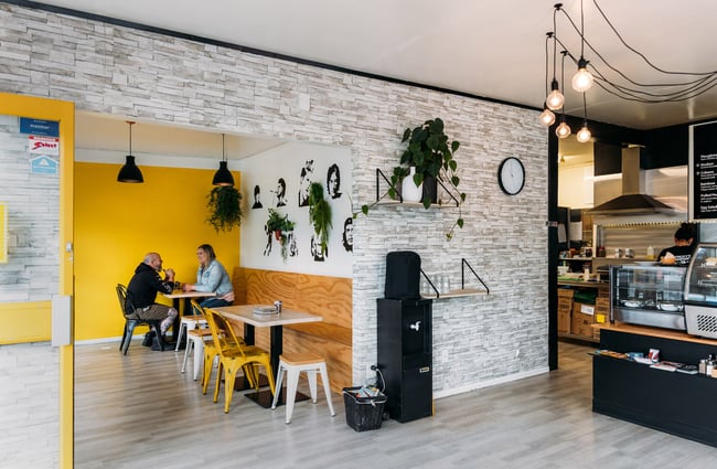 White and yellow interior of cafe sandwich joint