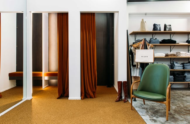 The burnt orange velvet curtains hanging in the changing rooms of True Hamilton.