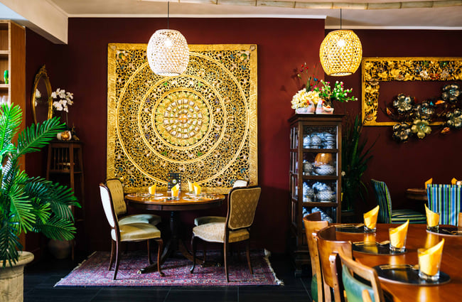 Table under some art at Tuk Tuk Thai.