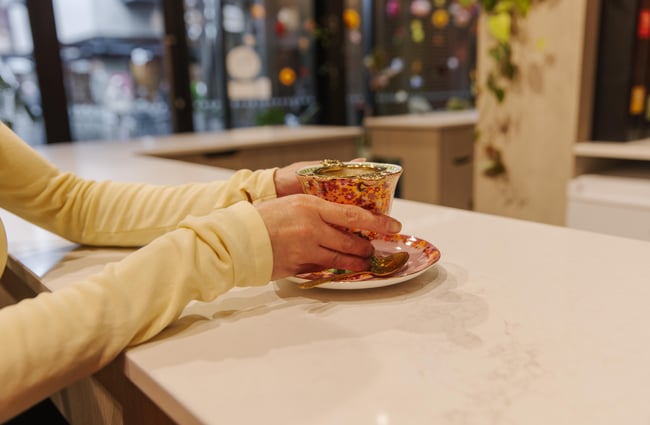 Customer enjoying a hot drink at Twiggi Hair.