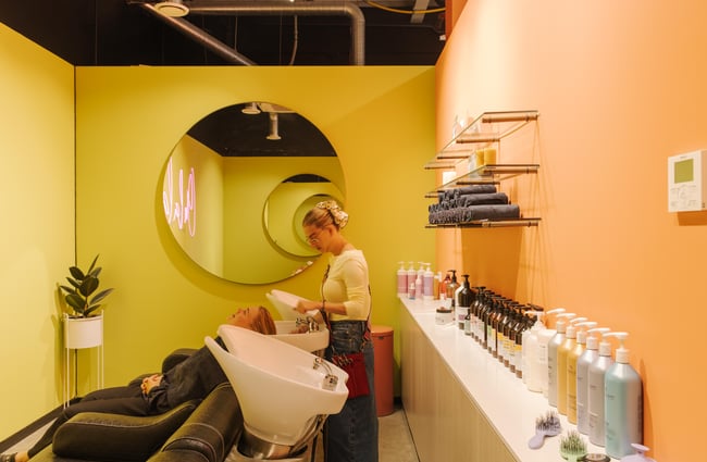 Customer getting their hair washed at Twiggi Hair.