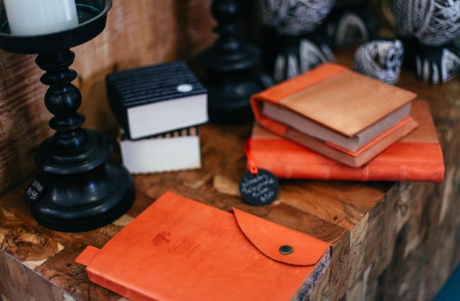 Orange leather bound books on display.