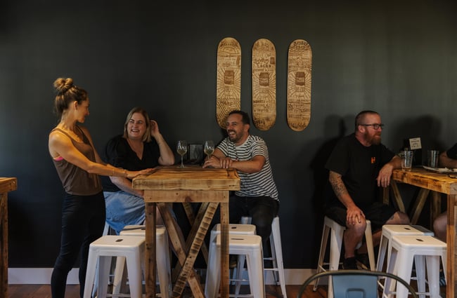 Customers sitting at a table inside at Two Thumb Brewing Co. Redcliffs.