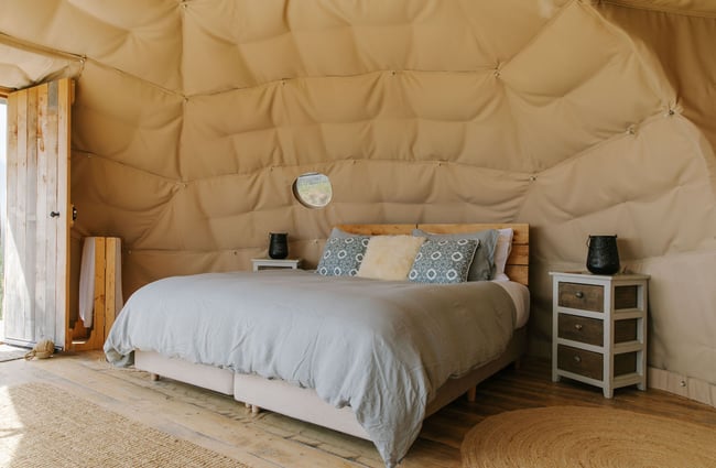 Bed inside a glamping pod at the Valley Views Glamping in Waitaki.