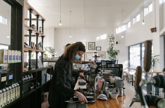 Barista making coffee at Vanguard.