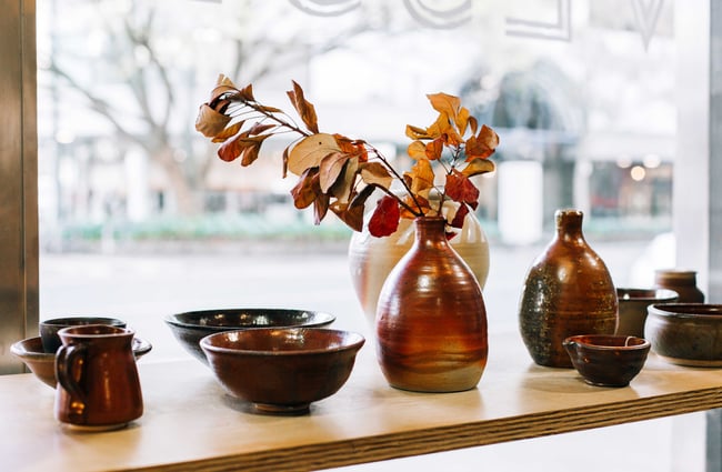 Pottery in window display.