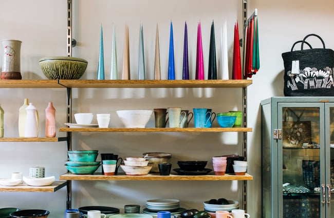 Shelves with candles and other trinkets.