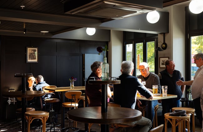 Customers dining inside Victoria Free House Christchurch.