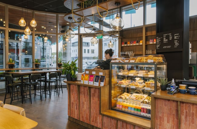 Food cabinet and high tables at Vivace Espresso.