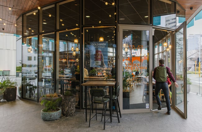 Customer walking through the front door at Vivace Espresso.