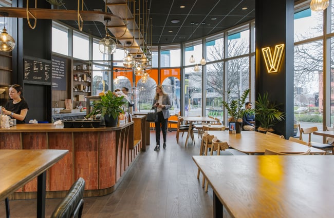 Customer walking up to the counter at Vivace Espresso.
