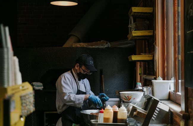 Chef working in the kitchen at Vogel Street Kitchen, Dunedin.
