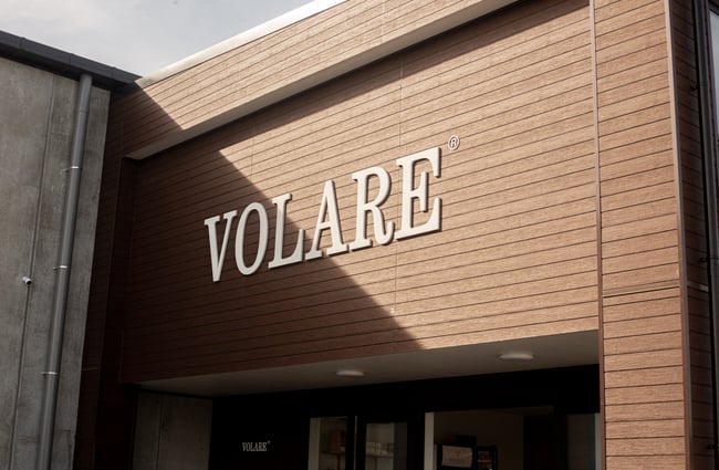 Signage on the building's exterior at Volare Bread.