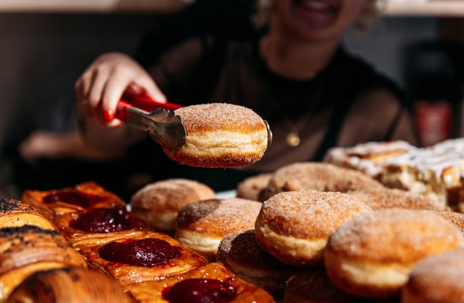 Doughnut being taken out of the cabinet at Volco Egmont Street.