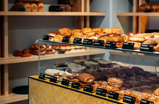 Lineup of pastries in the cabinet and on the shelves at Volco Egmont Street.
