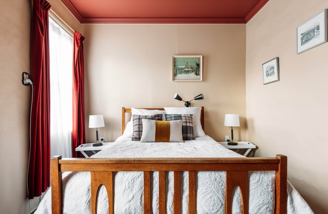 A bed in a hotel room.