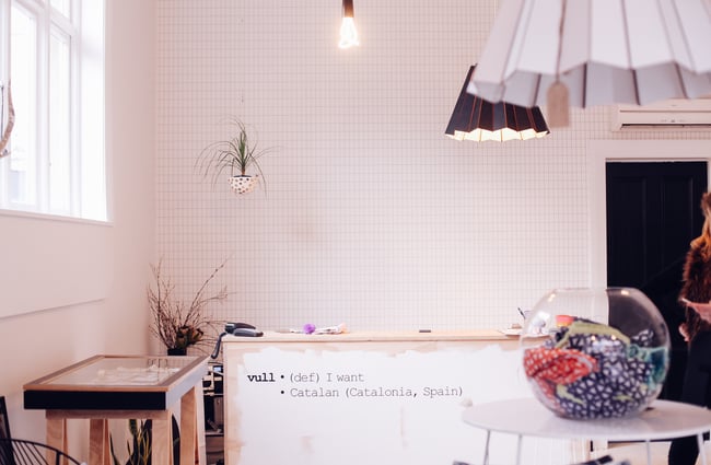 Inside of store with tiled walls.
