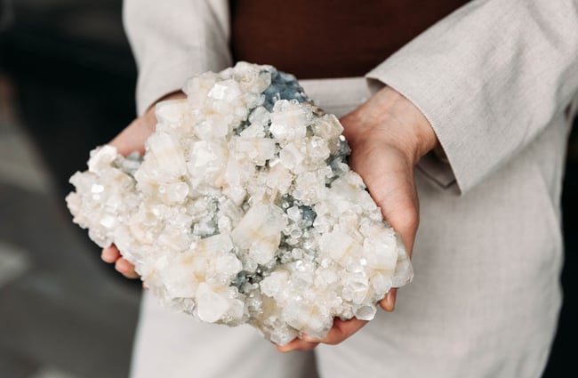 Large crystal held by shop assistant at VVITCHMOUNTAIN.