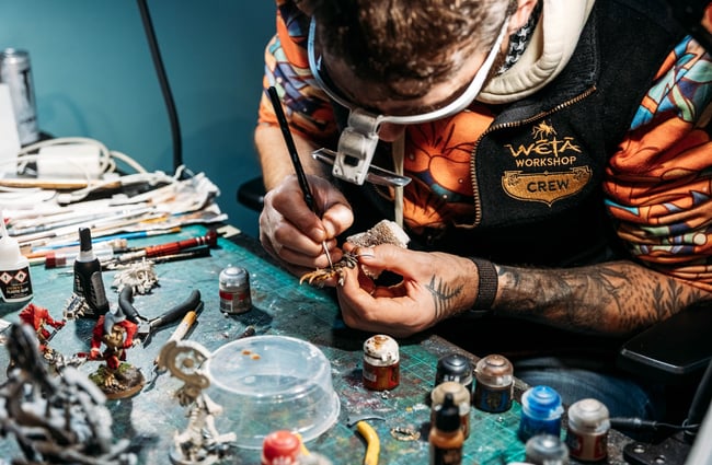 Close up of an artist at work.