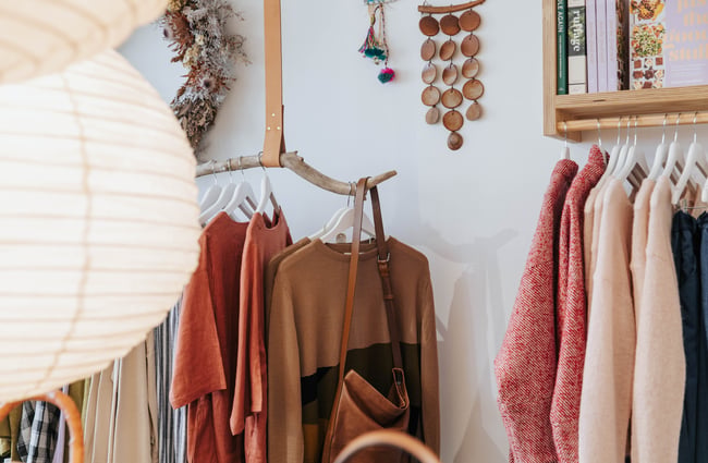 Close up of clothes on a rack.