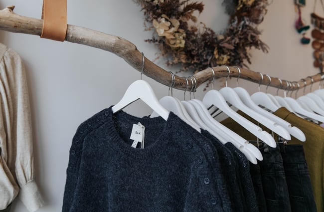 Close up of clothes on a rack.