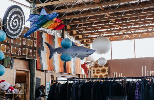 Hanging lampshades and shark from the ceiling.