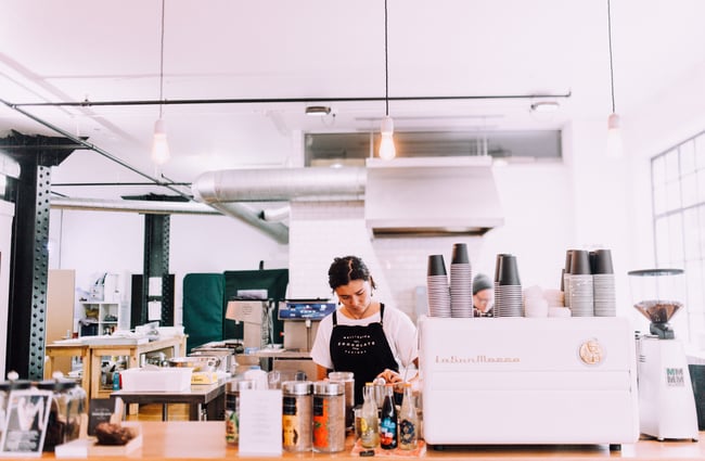 A barista making coffee.