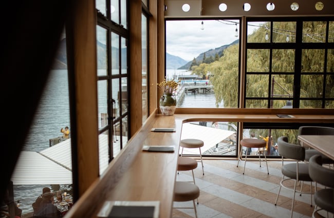 Window seats with view looking across Lake Whakatipu at Wharf Bar in Queenstown