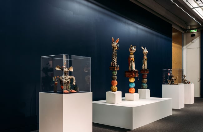 Ceramics on display on gallery plinths.