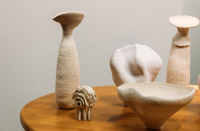 A close up of white ceramics on a table.