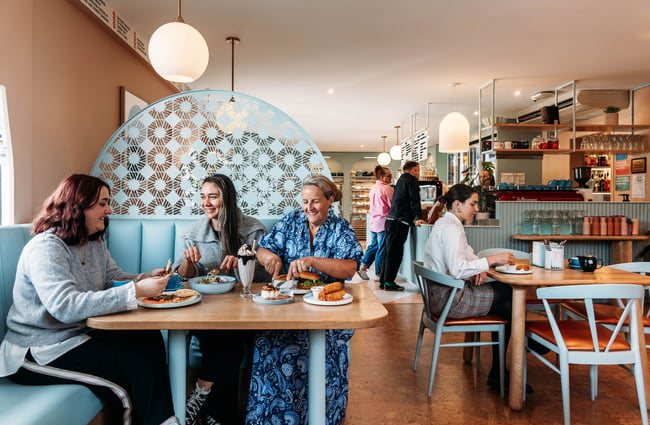 Group of women dining together at Whitestone Cheese Deli & Diner
