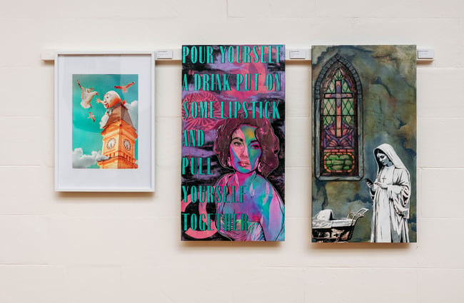 Three original artworks by Wicksey on the wall at his gallery and studio space