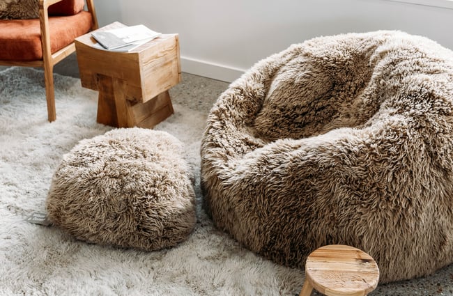 Close up of sheepskin cushions of different shades of brown at Wilson & Dorset, Wānaka.