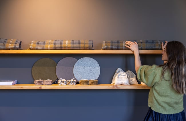 A customer looks at shelves in Wilson & Dorset.